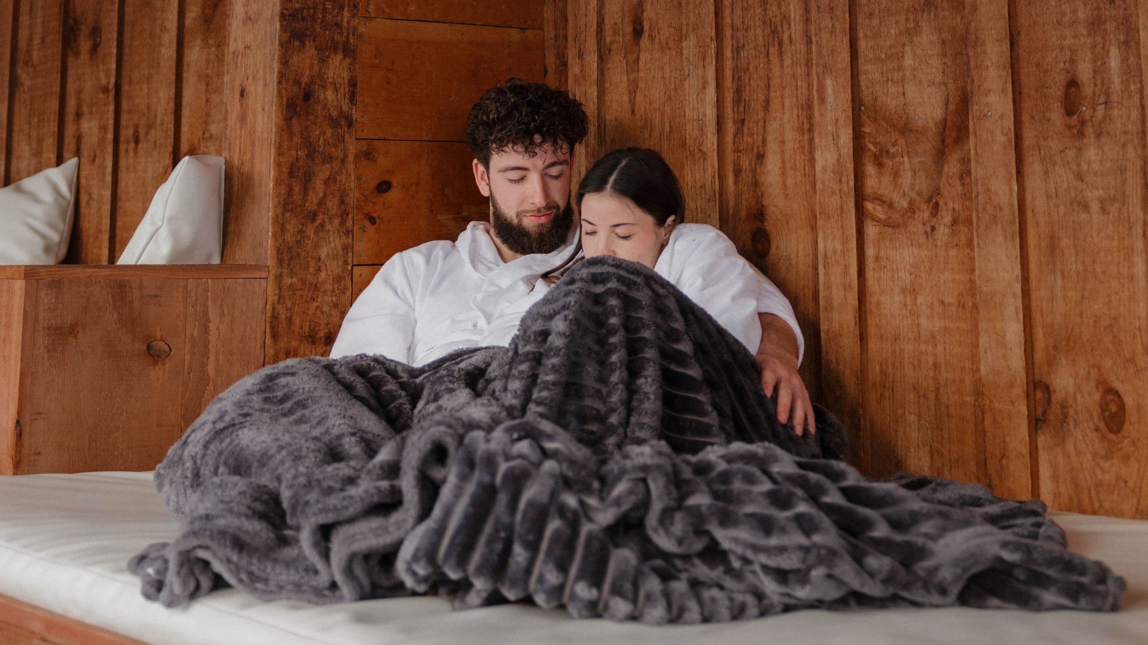 A couple relaxing at Scandinave Spa Blue Mountain.
