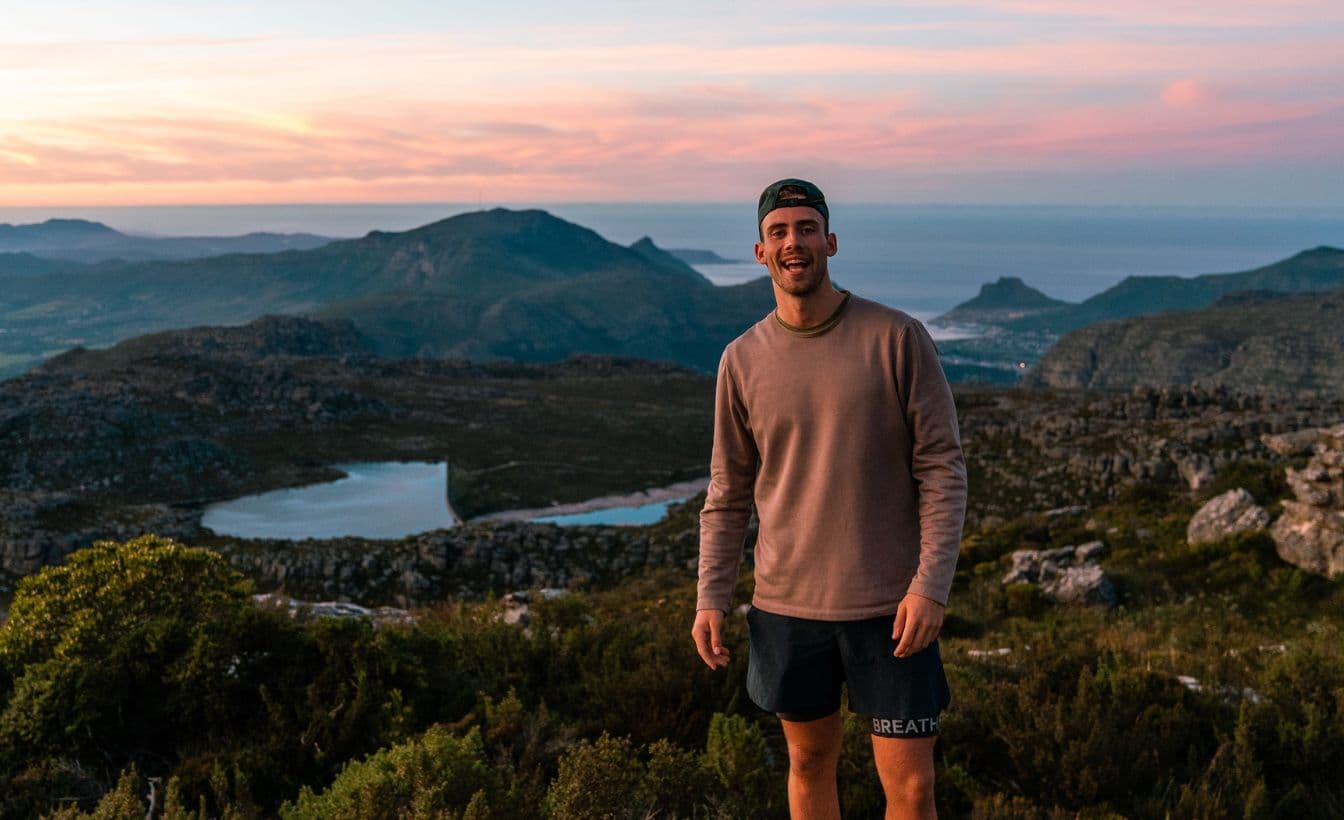 Endurance athlete, Connar Emeny, in front of a beautiful landscape.