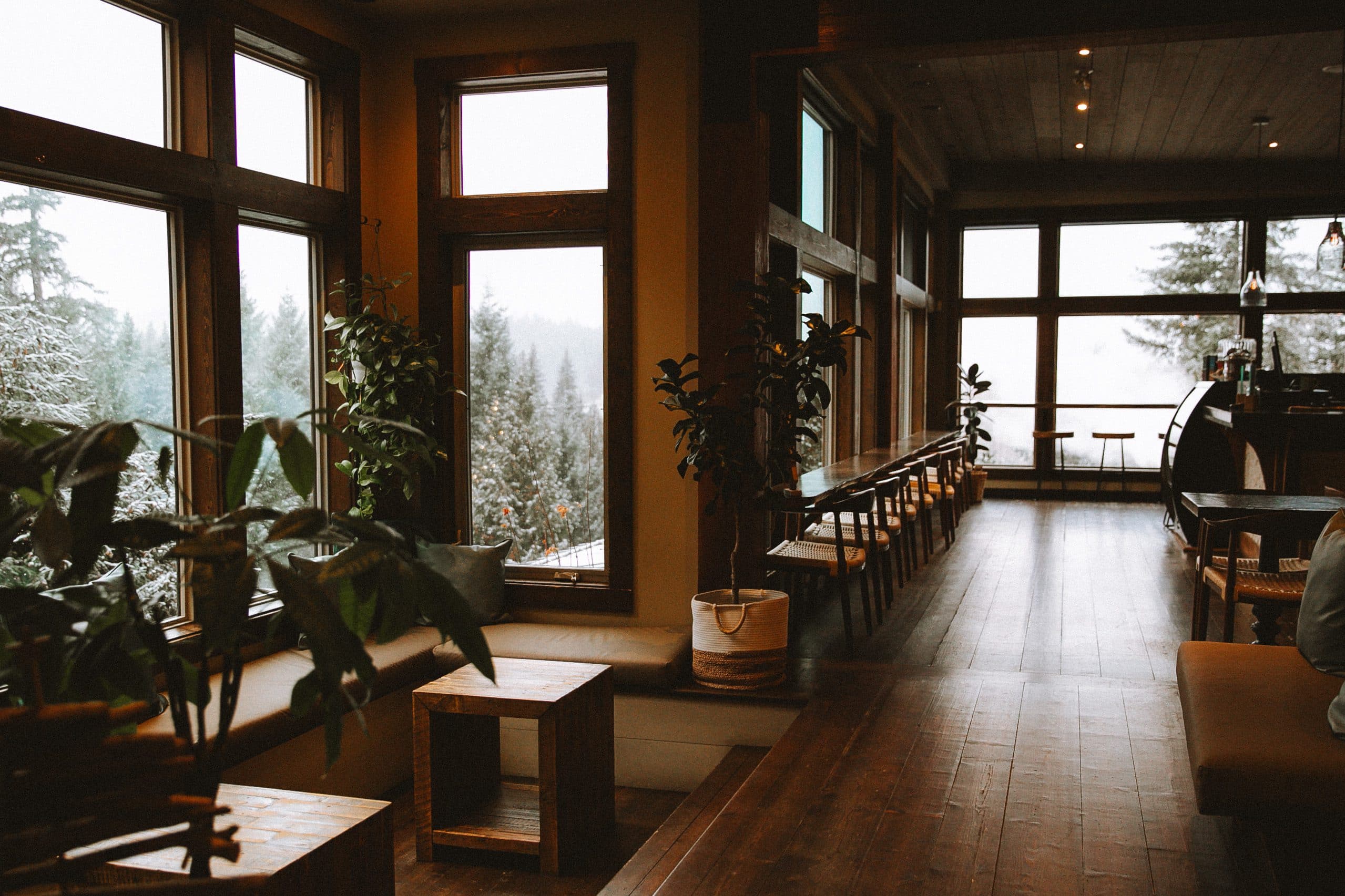 A view of the bistro at Scandinave Spa Whistler, surrounded by lush nature and serene outdoor settings.